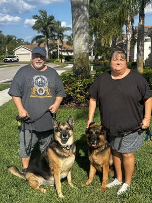 1788
RUM RUNNER WITH NEW MOM LORI AND DAD JIM DOG 1788
