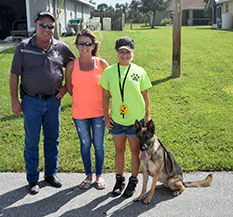 RAY RAY WITH MOM KIM DAD JIM AND TRAINER BREEZY  DOG 737
