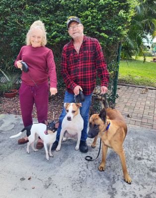 CHARLIE WITH NEW DAD SCOTT AND MOM MICHELE DOG 1291
Keywords: 1291